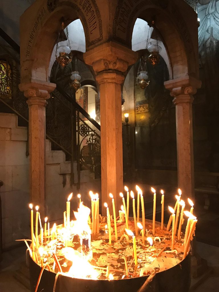 Lighted candles at Church of the Holy Sepulchre in Jerusalem, Israel. My time in Jerusalem, a special city divided