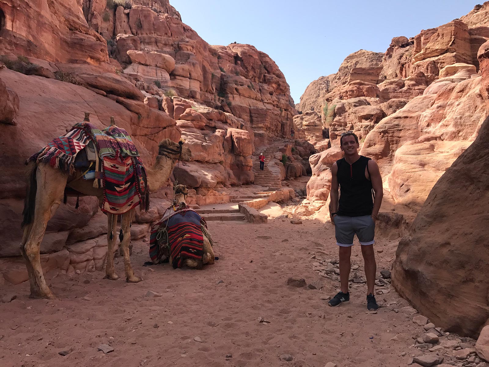 David Simpson with camels and incredible rock formations in Petra, Jordan. Petra, an incredible wonder