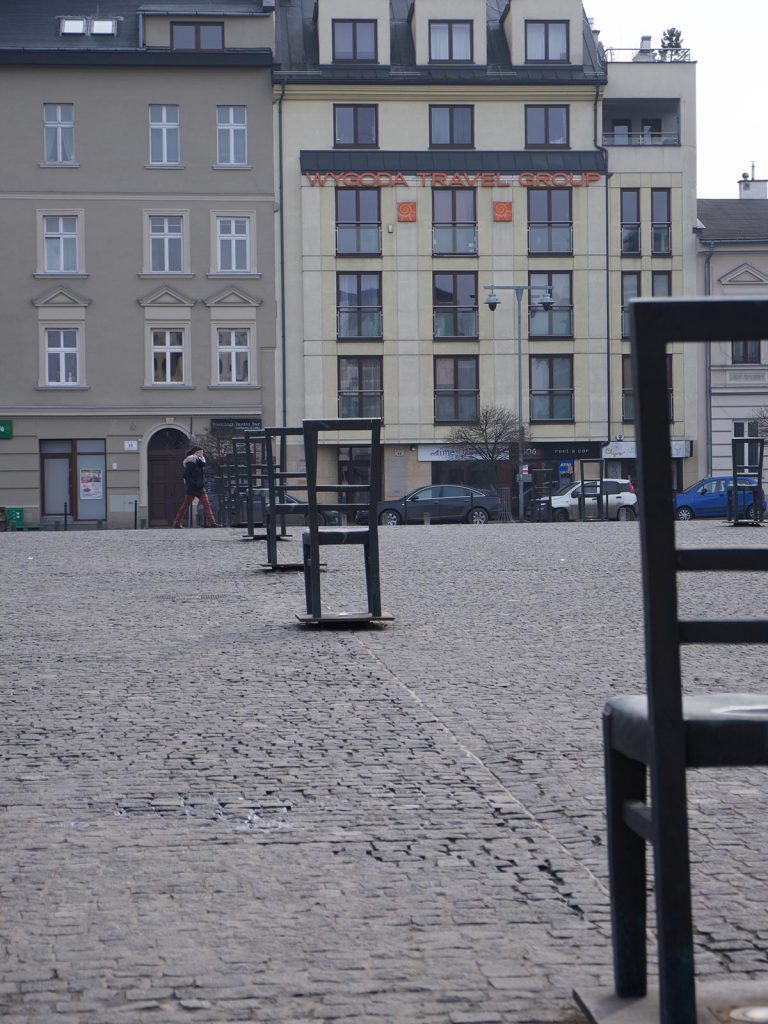 Chairs in line at Jewish Quarter in Kazimierz, Krakow, Poland. Mixed feelings in Auschwitz