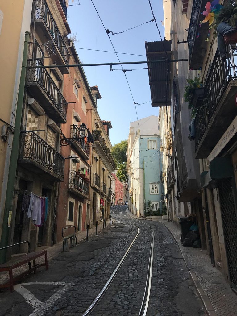 A narrow street with streetcar rails in Lisbon, Portugal. Lisbon & Porto, where the blog was conceived