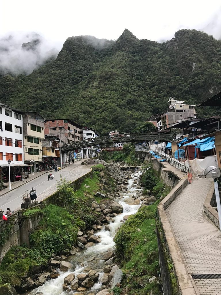 River in the middle of the town in Machu Picchu, Peru. Checking out Machu Picchu and Full Guide