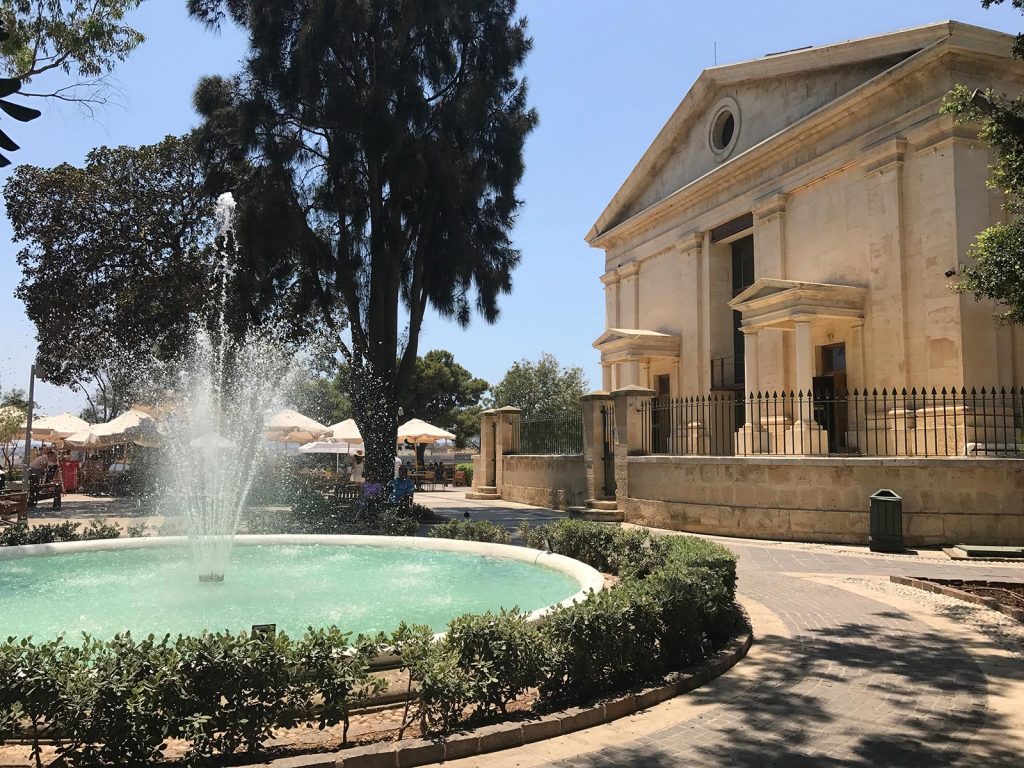 Fountain in front of a building in Valletta, Malta. Andorra, Barcelona & Malta