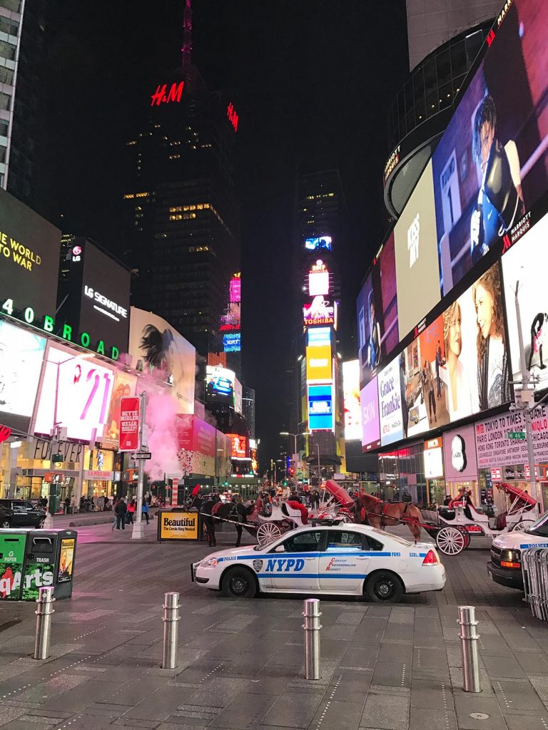 Squad car at Times Square in New York City, USA. A missed flight to New York