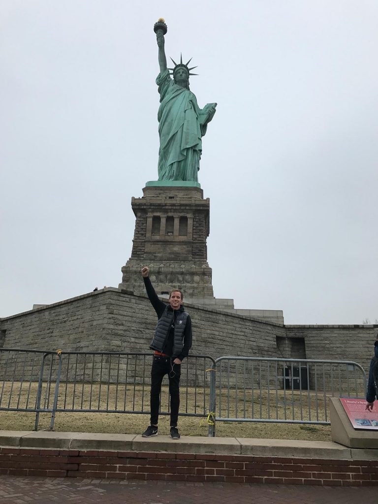 David Simpson at Statue of Liberty in New York City, USA. A missed flight to New York