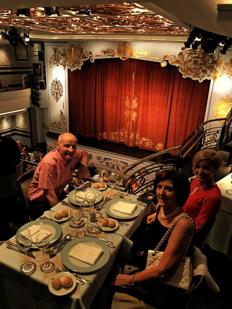 Family at dining table at a theater in Buenos Aires, Argentina. NYE in Buenos Aires