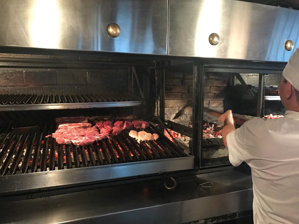 Cooking meat over charcoal in Buenos Aires, Argentina. NYE in Buenos Aires