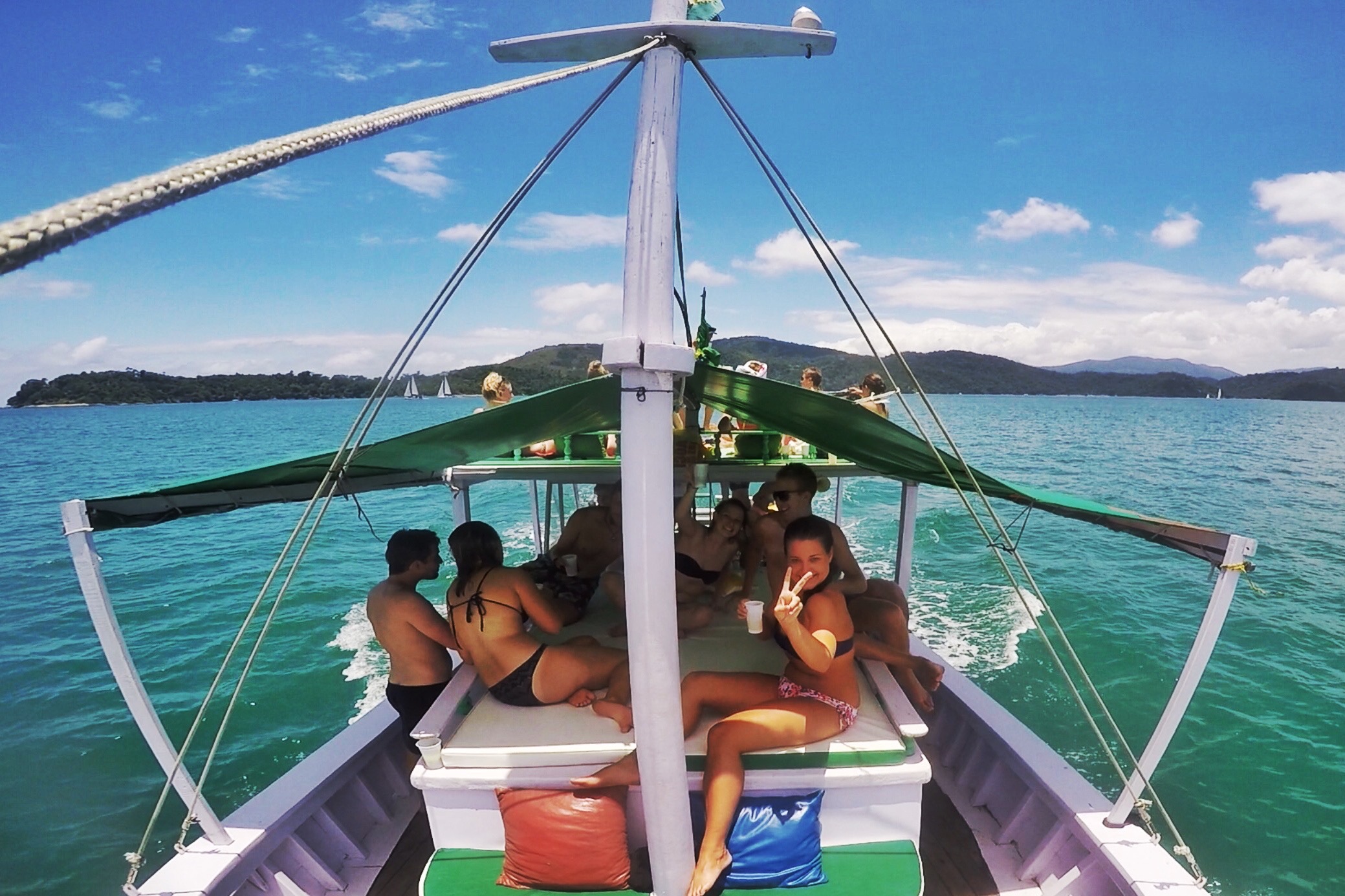 Friends onboard the party boat in Paraty, Brazil. Rockfalls, Paraty boat party and nearly losing my head
