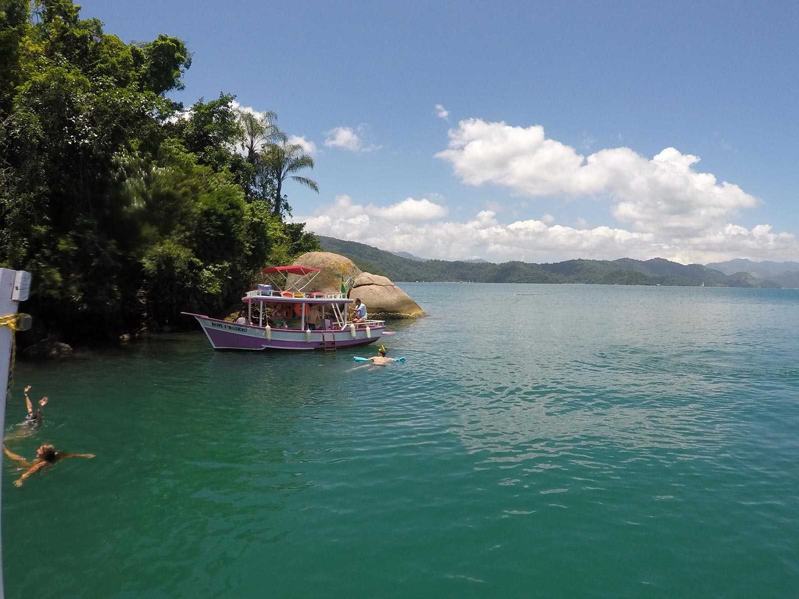 Party boat by the island in Paraty, Brazil. Rockfalls, Paraty boat party and nearly losing my head