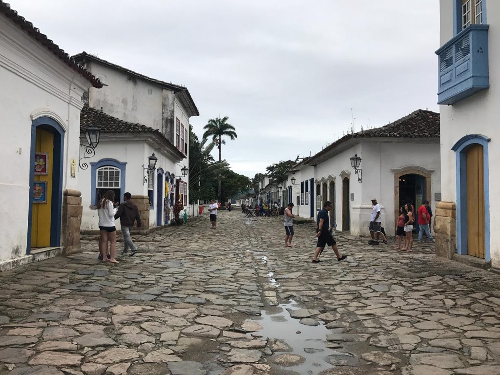 Neighborhood and cobblestone street and some locals in Paraty, Brazil. Rockfalls, Paraty boat party and nearly losing my head