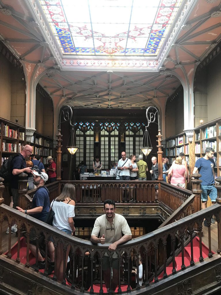 Friend at the stairs of Lello Bookshop in Porto, Portugal. Lisbon & Porto, where the blog was conceived