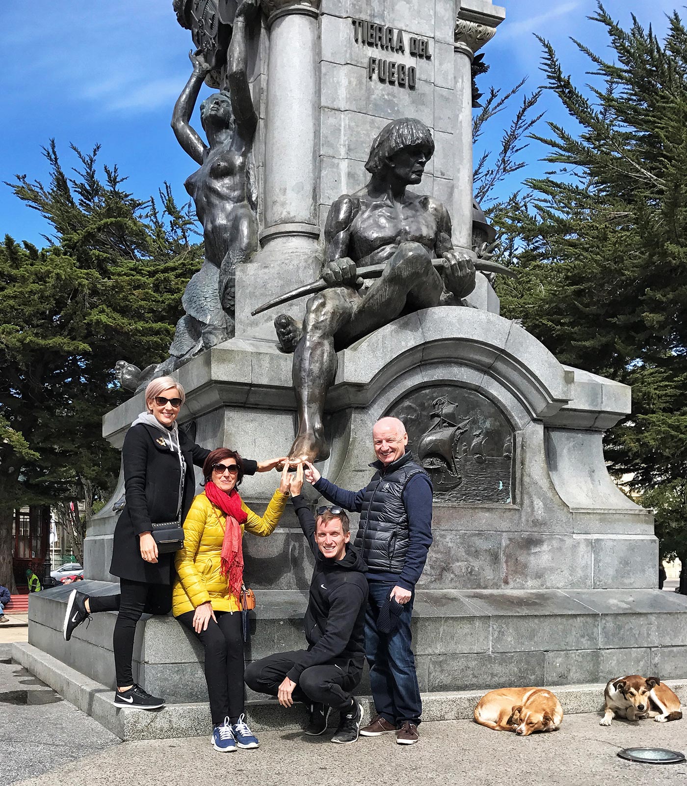 David Simpson and family touching the toe of Tierra del Fuego statue in Punta Arenas, Chile. Valparaiso & The Cruise to the end of the World pt3