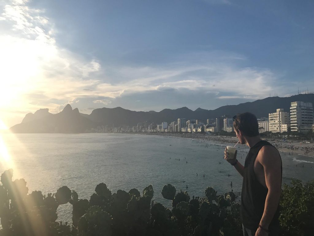 David Simpson at sunset on the beach in Rio de Janeiro, Brazil. Favelas, Christ & Sugarloaf, my intro to Rio