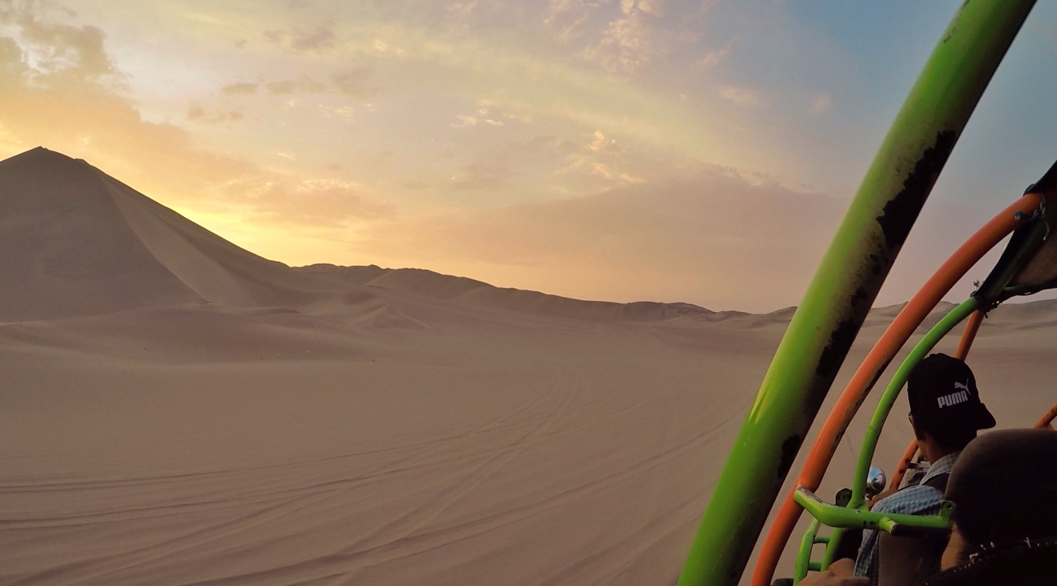 Dune buggy ride over sand dunes in Huacachina, Peru. Sand boarding in Huacachina & full guide