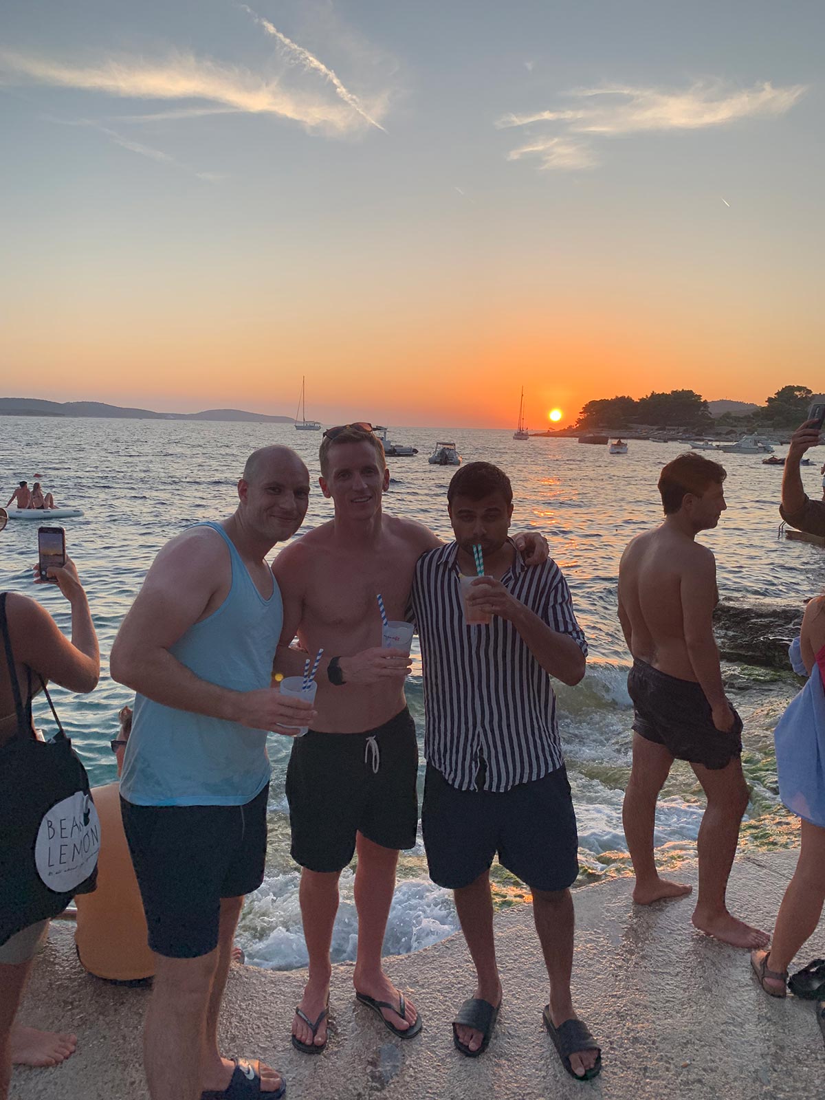 David Simpson and friends during sunset at beach in Hvar, Croatia. The booze cruise in Split that wasnt