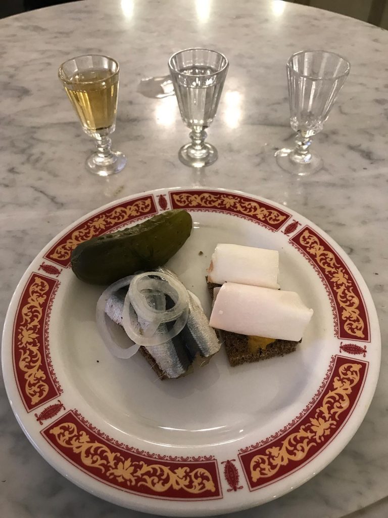 Vodka with fish and pickles in St. Petersburg, Russia. St Petersburg & The Red Arrow to Moscow