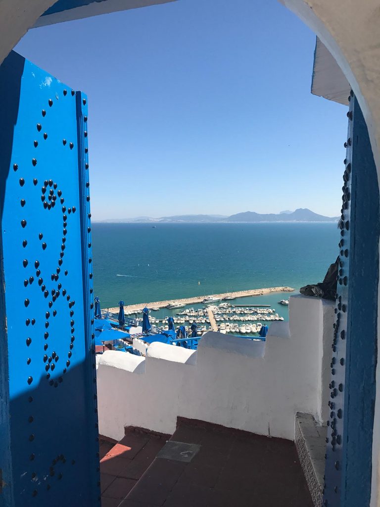 View of the sea by the door in Sidi Bou Said, Tunisia. Tunisia and not taking travel advice seriously