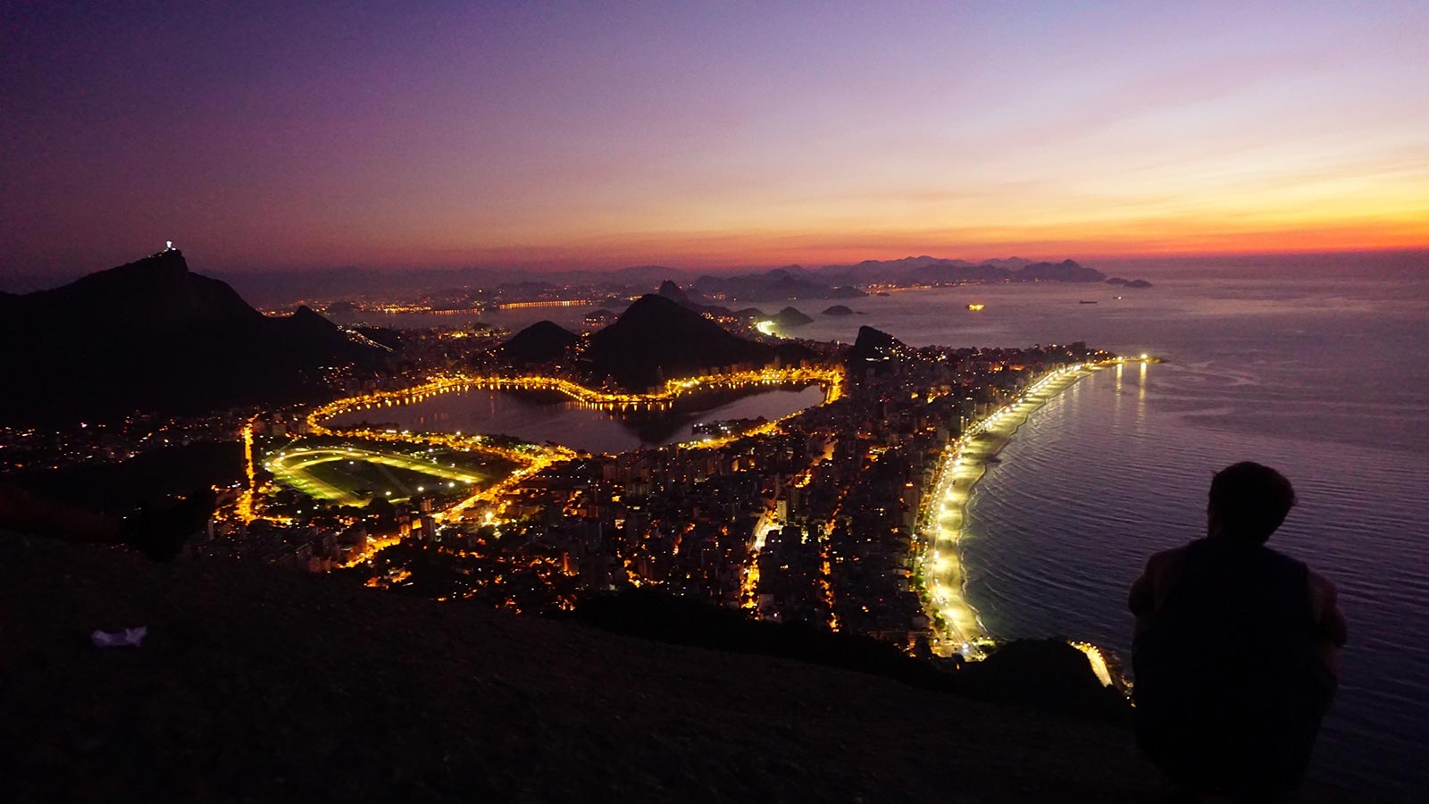 David Simpson enjoying the view at Two Brothers peak at night in Rio de Janeiro, Brazil. The best sunrise hike in the world
