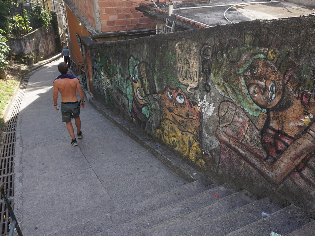David Simpson passing thru a favela neighborhood in Rio de Janeiro, Brazil. The best sunrise hike in the world