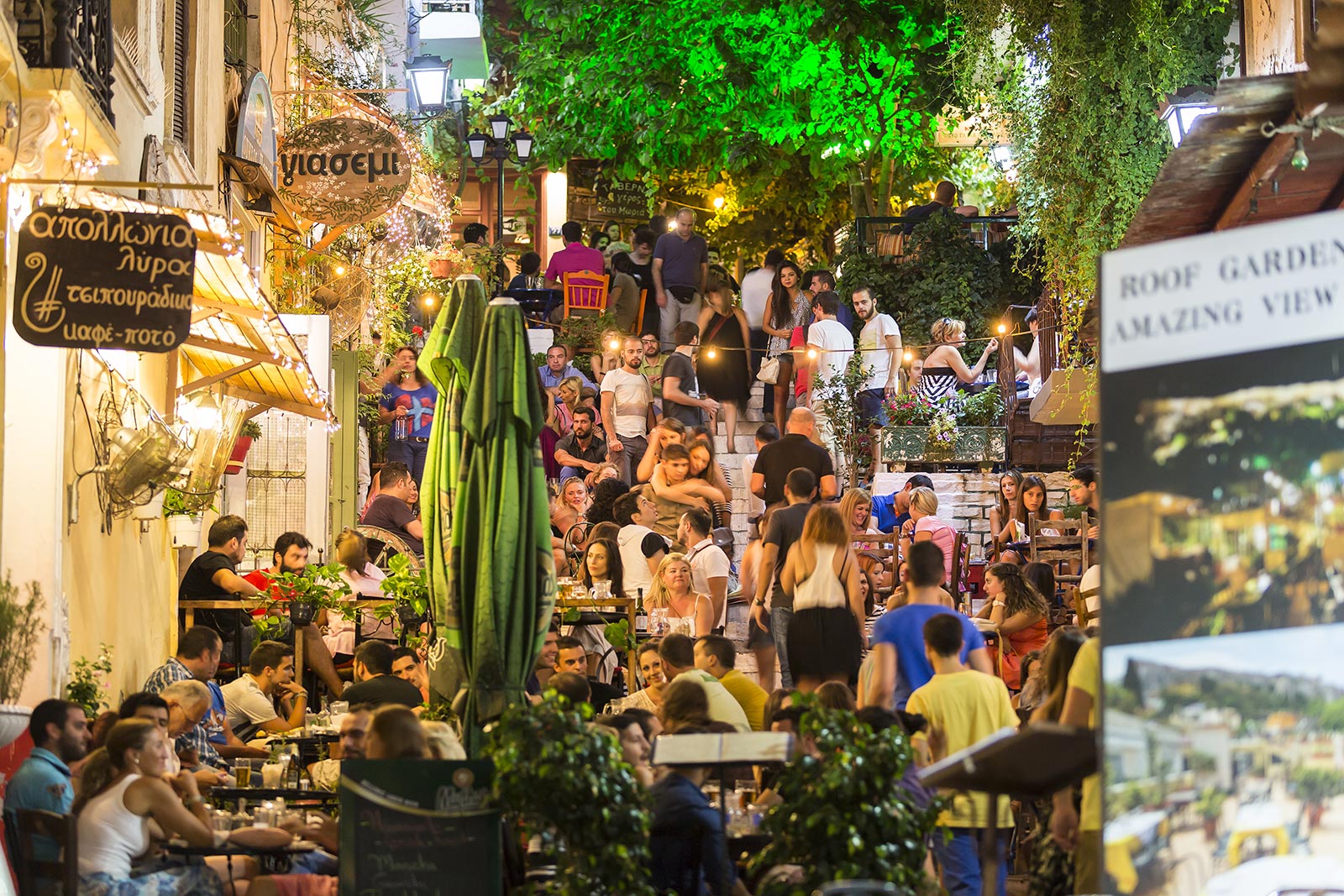 People having coffee at Plaka street in Athens. 10 things you must do in Athens