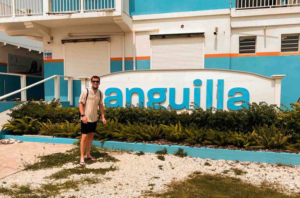 David Simpson standing infront of a building in Anguilla. Caribbean reflection; beaches, late PCRs & incredible accom
