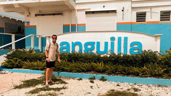 David Simpson standing infront of a building in Anguilla. Caribbean reflection; beaches, late PCRs & incredible accom