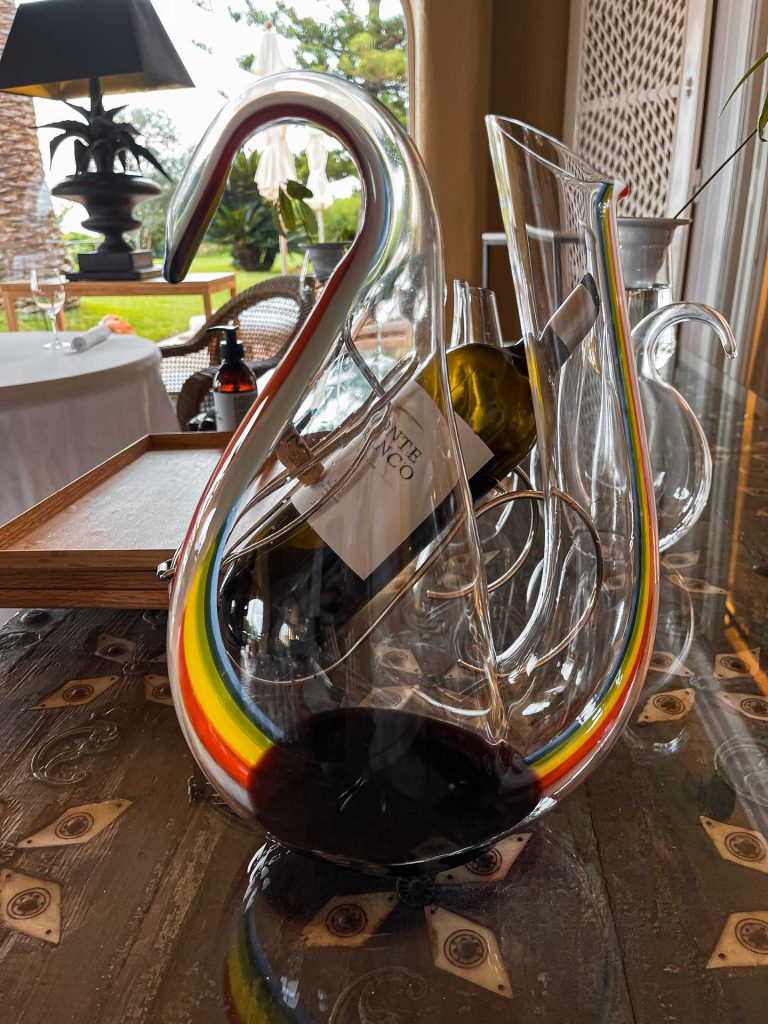 Bottle of wine in glass holder at Vila Joya, Portugal. The best meal at 2* Vila Joya