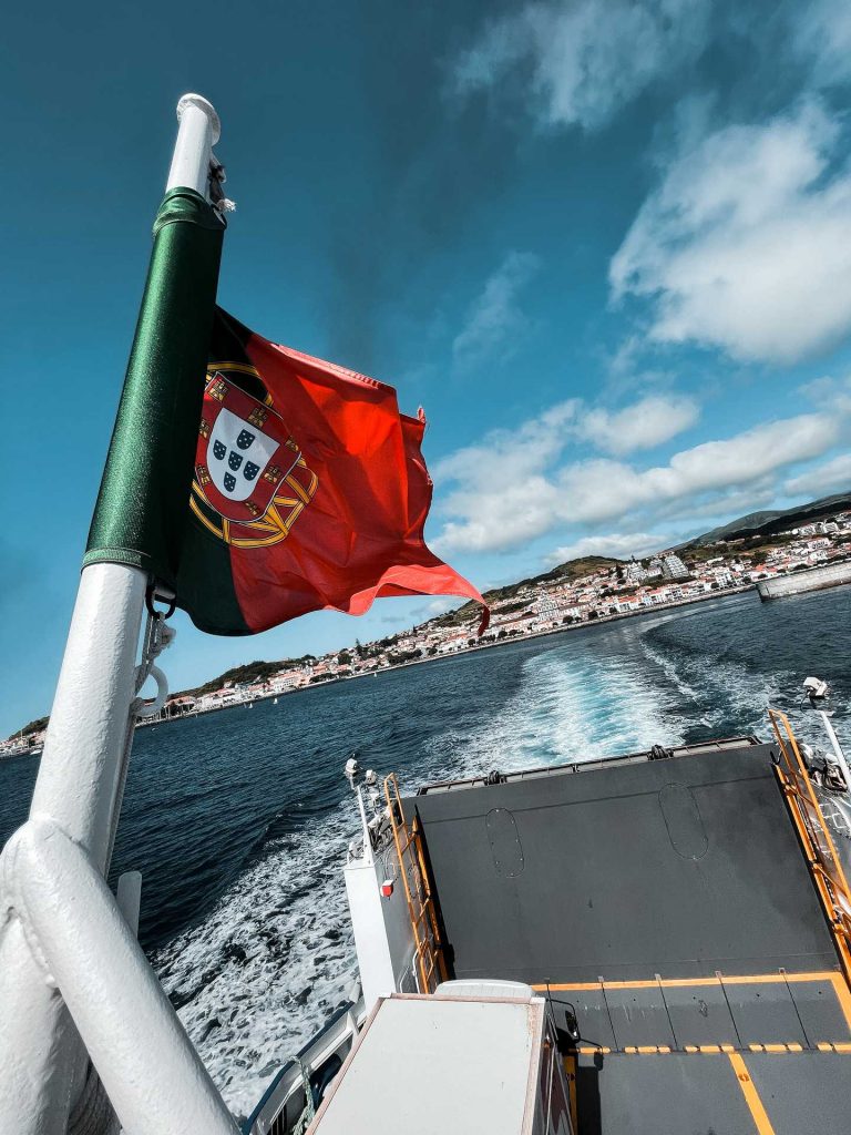 Flag on a boat in Horta, The Azores. Camping in volcano Pico, Portugal’s highest mountain