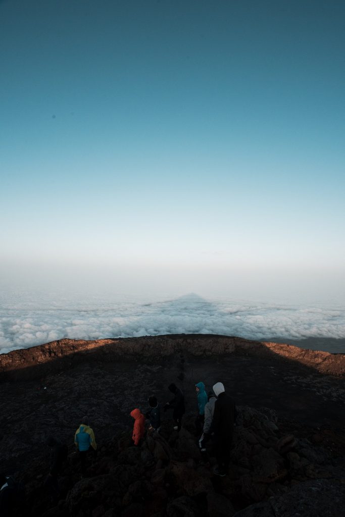 Climbers on top of mountain in Pico, The Azores. Camping in volcano Pico, Portugal’s highest mountain