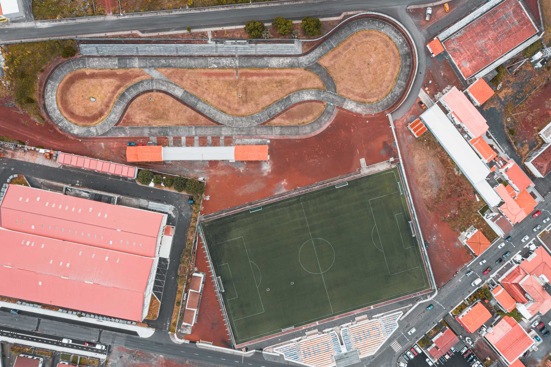 Aerial view of football field and other buildings in Pico, The Azores. Pico views and trouble parking at the whaling museum