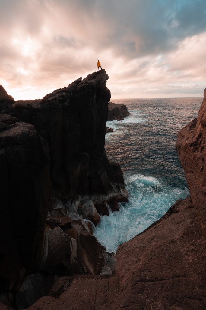 David Simpson standing on the cliffs near the sea in Terceira Island, The Azores. Terceira, another photographer’s dream