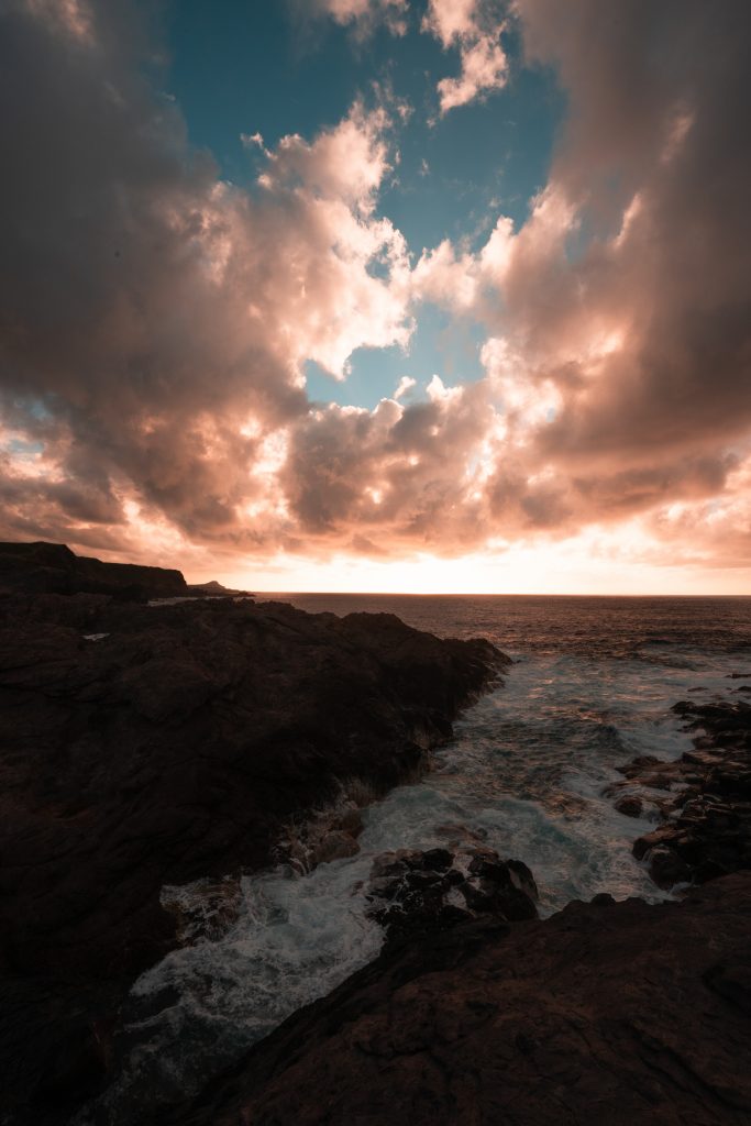Sunset by the rocky cliffs near the sea in Terceira Island, The Azores. Terceira, another photographer’s dream