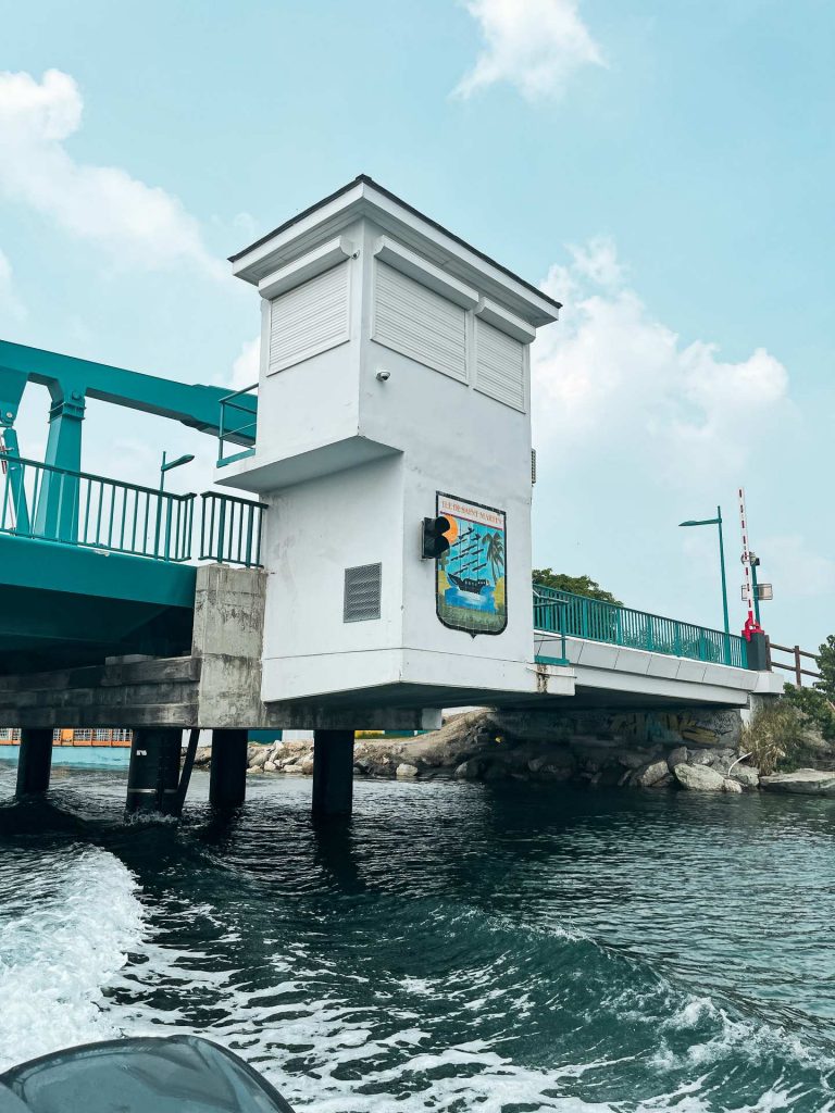 Bridge with coat of arms painted on it in Anguilla. Unexpected access into Anguilla