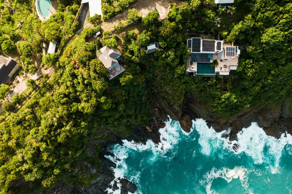 Aerial view of the sea, island, trees and houses in British Virgin Islands. BVI has me