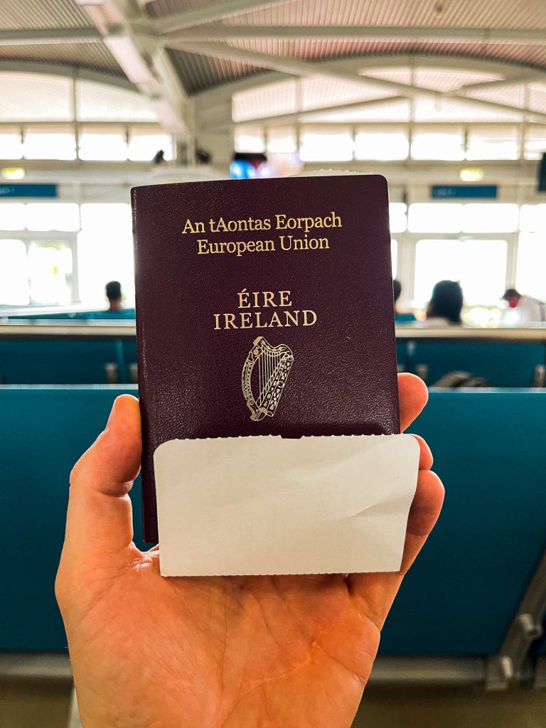 hand holding Ireland passport at the airport in British Virgin Islands. The baths at Virgin Gorda