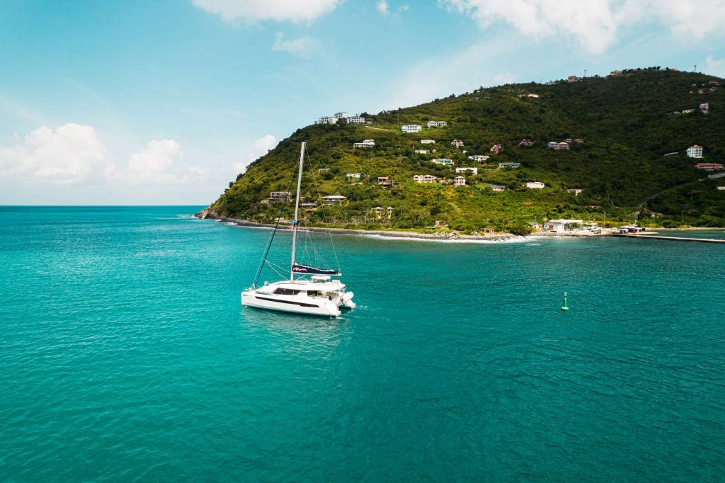 Aerial view of a yatch, the sea and the island in British Virgin Islands. BVI has me