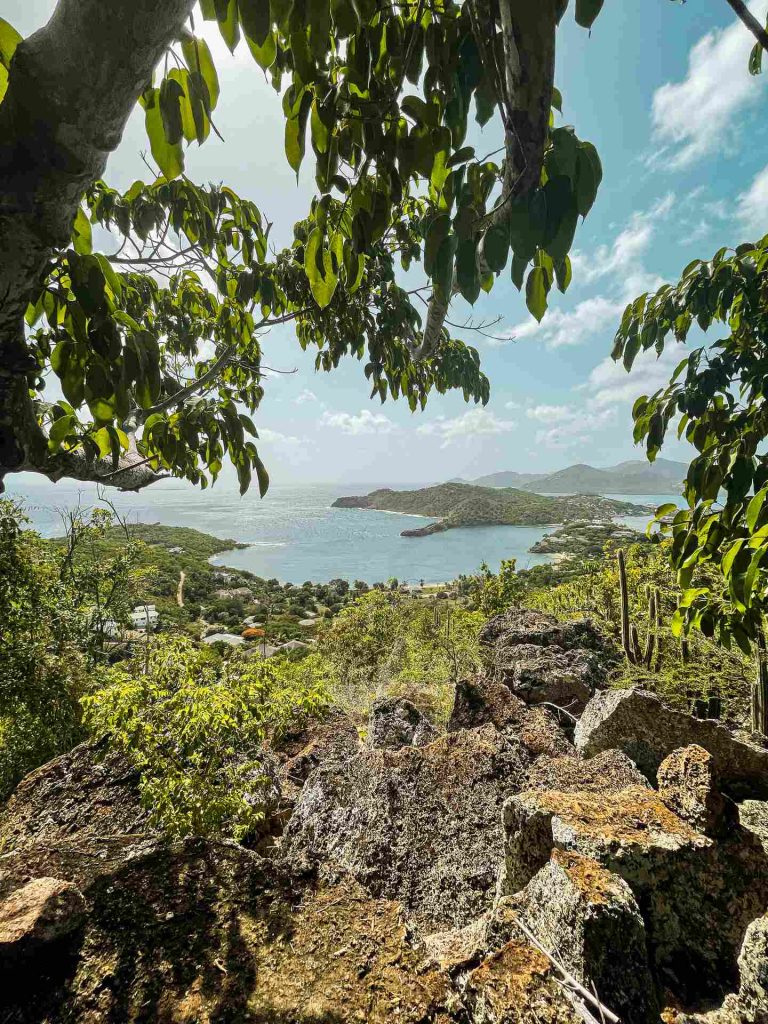 Big rocks and view of harbor in Antigua. Sir Vivian Richards & don’t hike in flip flops