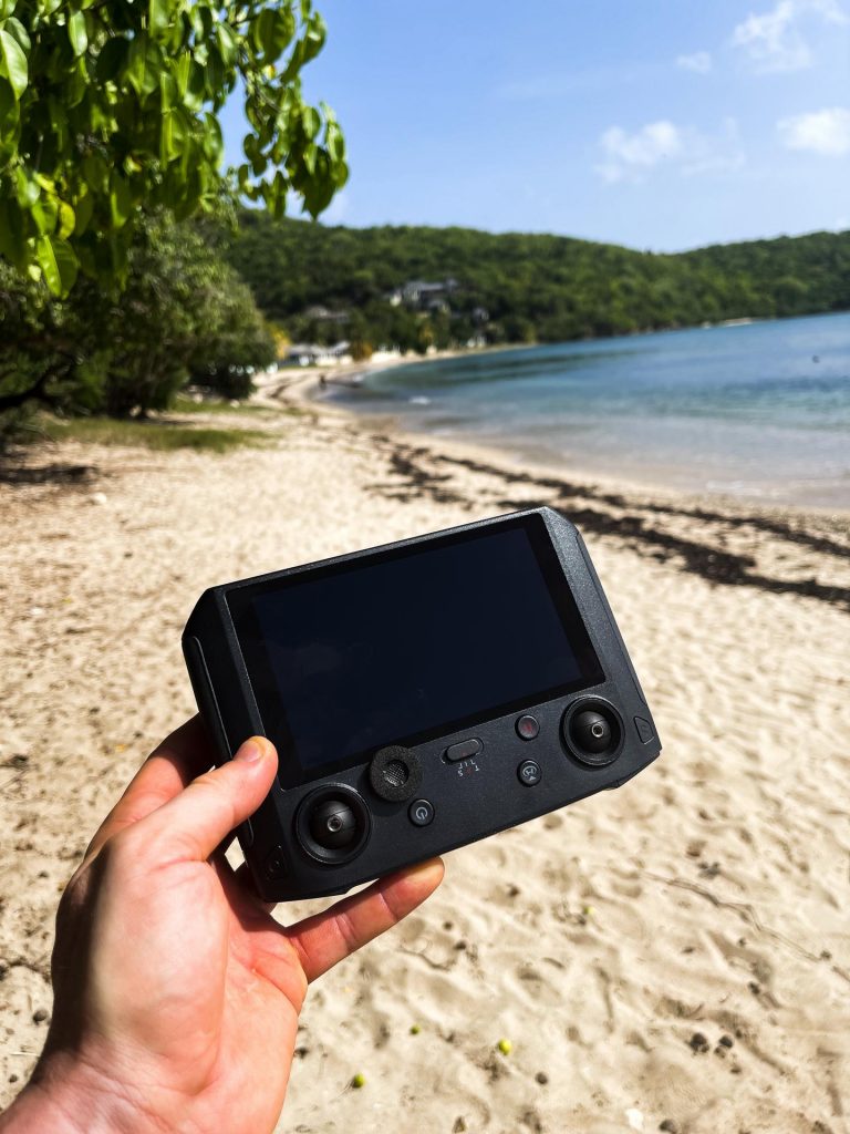 Holding handheld controller by the beach in Antigua. Sir Vivian Richards & don’t hike in flip flops
