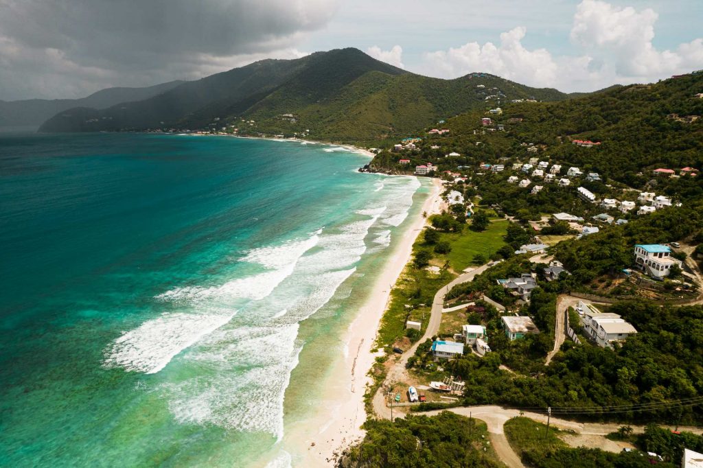 Aerial view of the sea, beach and the island with houses in British Virgin Islands. BVI has me