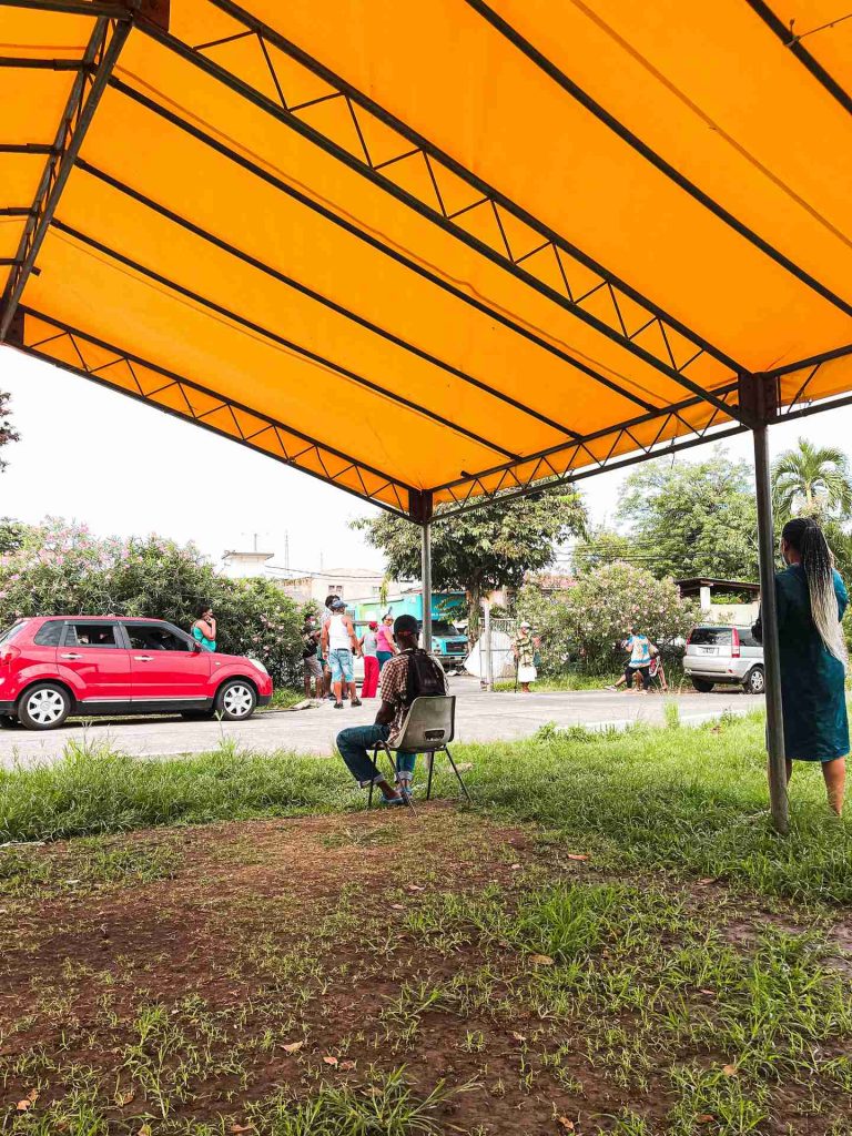 Tent by the street with parked cars in Dominica. The start of a Covid nightmare