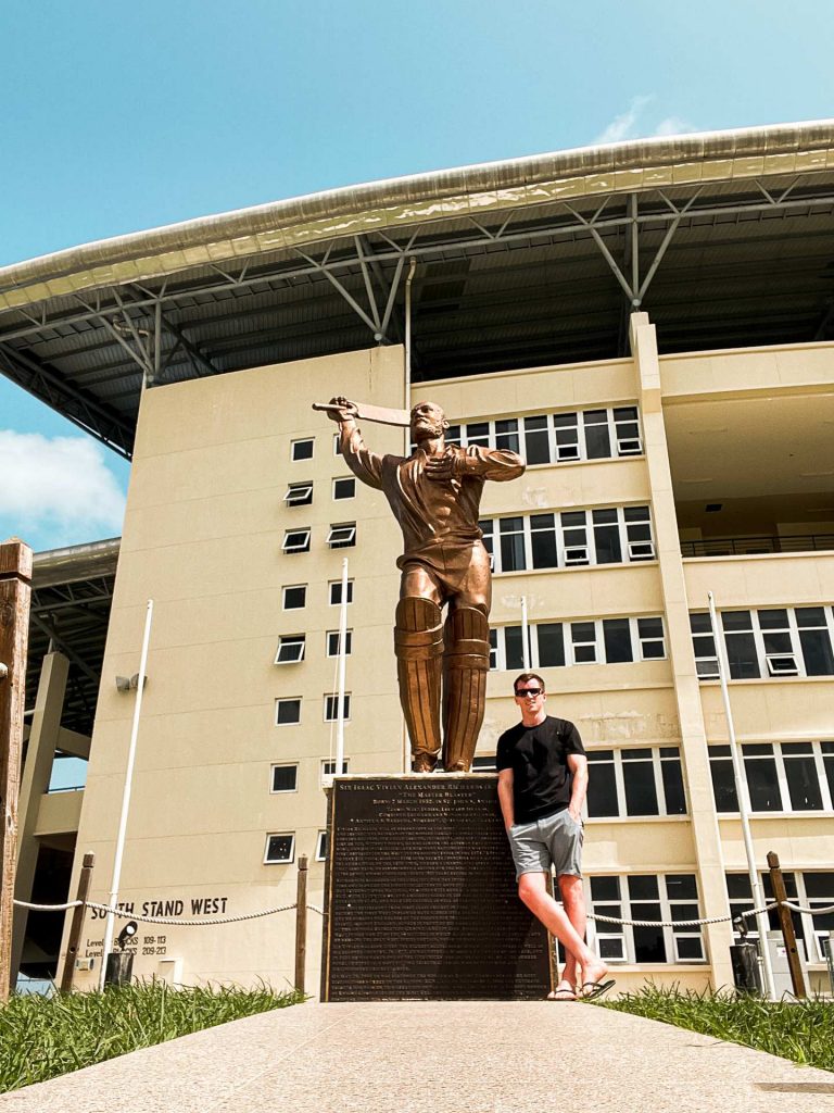 David Simpson standing by the statue of Sir Vivian Richards outside the stadium in Antigua. Sir Vivian Richards & don’t hike in flip flops