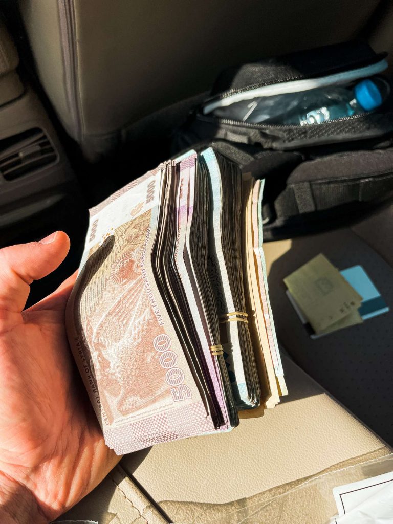 Wads of money in Syria. Driving into Syria
