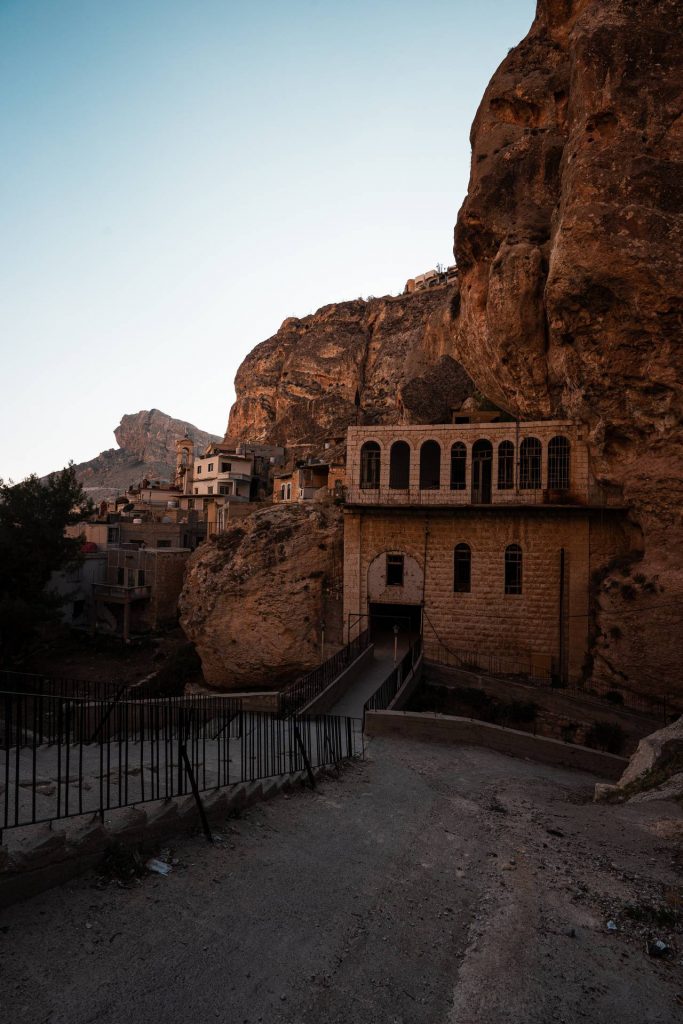 Church of Saint Takla by the cliffs in Syria. Driving into Syria