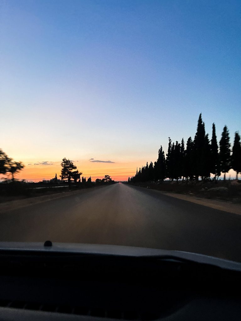 Sunset road trip from Church of Saint Takla in Syria. Driving into Syria
