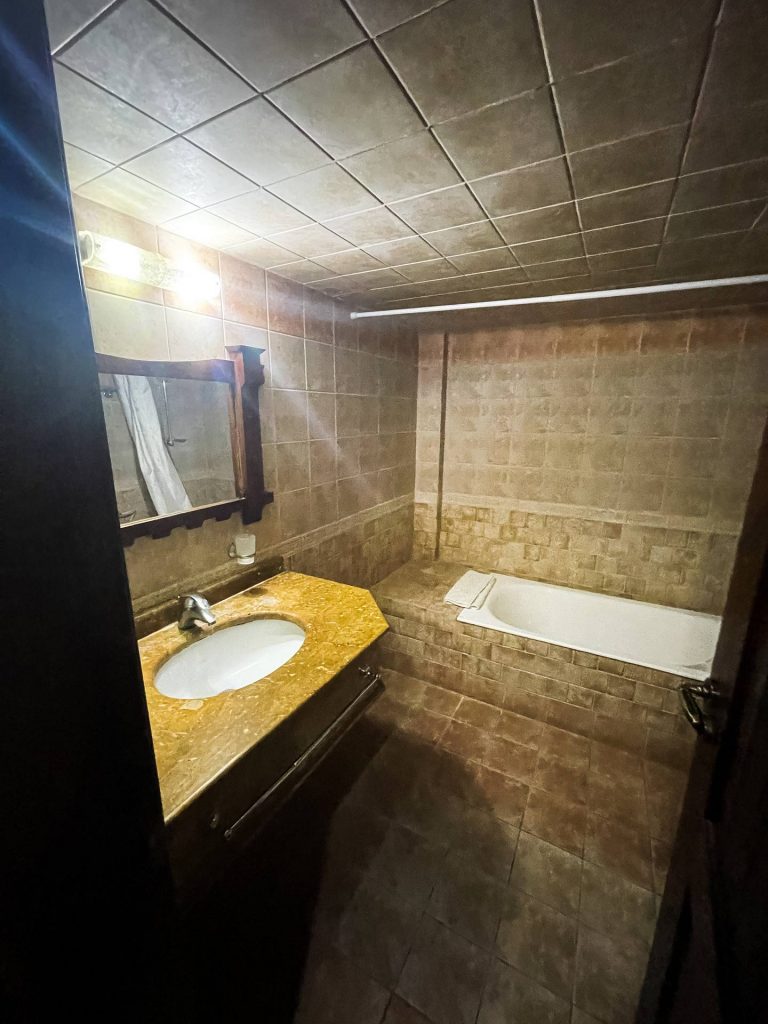 Bathroom accommodations in Al Wadi hotel in Al Mashtayah in Syria. Driving into Syria