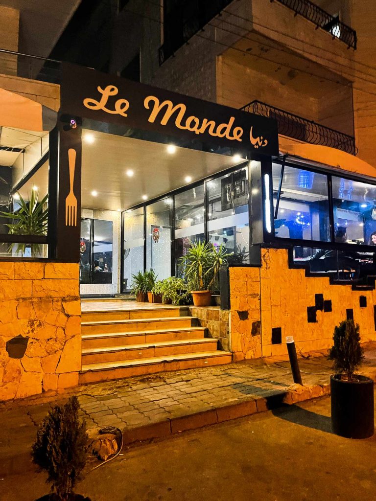 Le Monde restaurant at night in Al Mashtayah in Syria. Driving into Syria