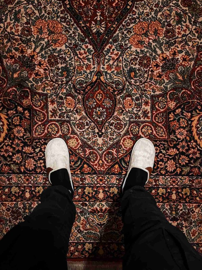 Feet on carpet in hotel in Hama in Aleppo. A day in Hama, Syria
