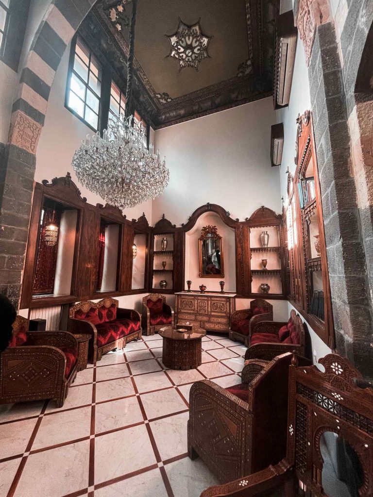 Inside a receiving room with sofa seats and chandelier in Damascus, Syria. A day in Damascus