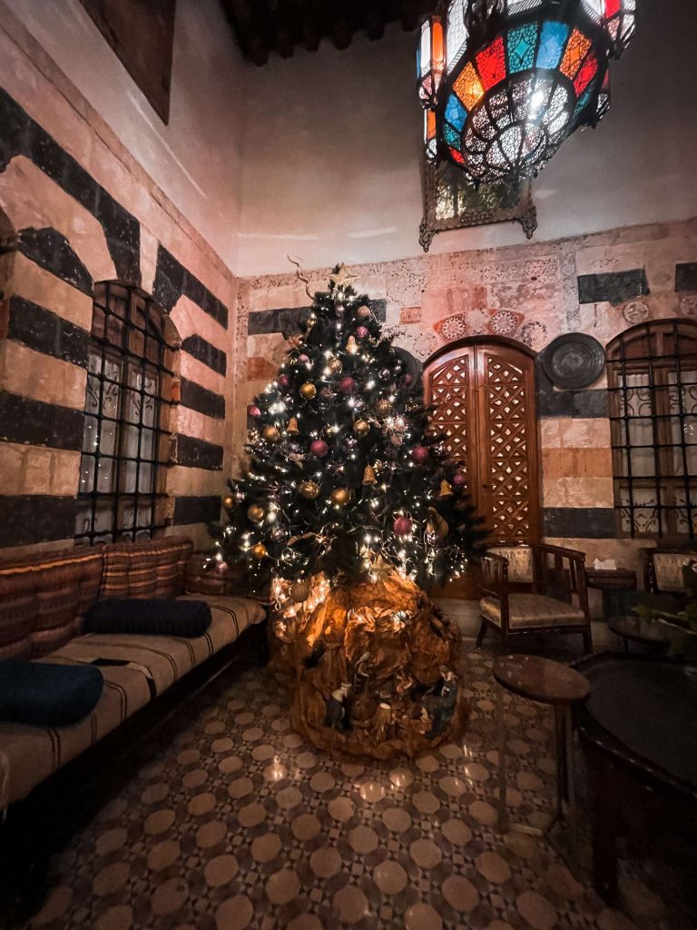 Christmas tree by the sofas and chairs in Damascus, Syria. A day in Damascus