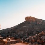 David Simpson viewing the houses and buildings by the mountainside in Beirut. The Syrian Series reflection post