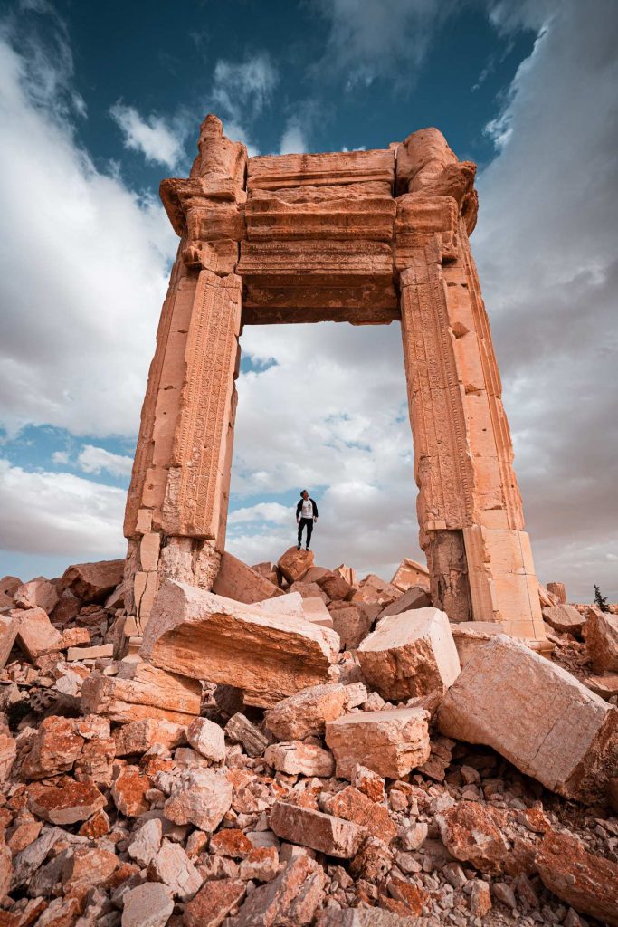 David Simpson standing on archaeological site in Palmyra. The Syrian Series reflection post